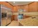 Modern kitchen with stainless steel appliances and granite countertops at 846 N Pueblo Dr # 111, Casa Grande, AZ 85122