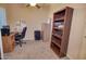 Home office with built-in shelving, desk, and chair at 846 N Pueblo Dr # 111, Casa Grande, AZ 85122