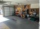 Garage workshop featuring workbench, tools, and storage shelving at 2544 E Hillery Dr, Phoenix, AZ 85032