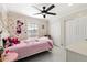 Charming bedroom with Minnie Mouse theme, built in closet and ceiling fan at 16008 N 56Th Way, Scottsdale, AZ 85254