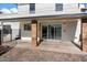 Covered patio with brick flooring and sliding glass doors at 16008 N 56Th Way, Scottsdale, AZ 85254