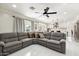 Spacious living room featuring a sectional sofa and open floor plan at 16008 N 56Th Way, Scottsdale, AZ 85254