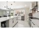 Well-equipped kitchen featuring an island and stainless steel appliances at 16008 N 56Th Way, Scottsdale, AZ 85254