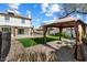 Backyard with artificial turf, gazebo, patio, and brick pavers at 16008 N 56Th Way, Scottsdale, AZ 85254