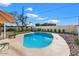 Inviting kidney-shaped pool with surrounding rock and gazebo at 16008 N 56Th Way, Scottsdale, AZ 85254