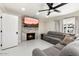 Cozy living room with a fireplace and comfortable seating at 16008 N 56Th Way, Scottsdale, AZ 85254