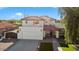 Two-story house with white exterior, terracotta roof and driveway at 16008 N 56Th Way, Scottsdale, AZ 85254
