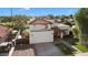 Two-story house with white exterior, terracotta roof and driveway at 16008 N 56Th Way, Scottsdale, AZ 85254