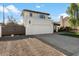 Two-story house with a brown gate and artificial turf front yard at 16008 N 56Th Way, Scottsdale, AZ 85254
