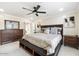 Spacious main bedroom with a king-size bed and ensuite bathroom at 16008 N 56Th Way, Scottsdale, AZ 85254