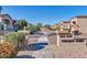 Inviting entrance to Contento Court, a community with well-maintained landscaping at 18254 N 136Th Ave, Sun City West, AZ 85375