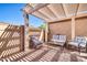 Relaxing patio with pergola, seating area, and brick flooring at 18254 N 136Th Ave, Sun City West, AZ 85375