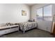 Cozy bedroom with window, carpet, and dresser at 2914 E Gary Way, Phoenix, AZ 85042