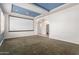 Bonus room with blue ceiling, wall-mounted projector screen and carpet at 2914 E Gary Way, Phoenix, AZ 85042