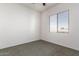 Simple bedroom with window, carpet and ceiling fan at 2914 E Gary Way, Phoenix, AZ 85042