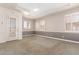 Spacious bedroom with neutral walls and carpet, featuring plantation shutters and built-in shelving at 2914 E Gary Way, Phoenix, AZ 85042