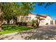 View of the home's exterior, highlighting the garage and landscaping at 2914 E Gary Way, Phoenix, AZ 85042