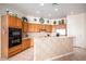 Kitchen features wood cabinets, tile floors and stainless steel appliances at 2914 E Gary Way, Phoenix, AZ 85042