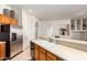 Kitchen features a double sink, tile counters and stainless steel refrigerator at 2914 E Gary Way, Phoenix, AZ 85042