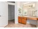 Bathroom with wood vanity, large mirror, and tiled floor at 2914 E Gary Way, Phoenix, AZ 85042