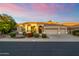 One-story home with three car garage and desert landscaping at 18221 N 53Rd St, Scottsdale, AZ 85254