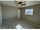 Well-lit bedroom with ceiling fan and tile floors at 3637 W Myrtle Ave, Phoenix, AZ 85051