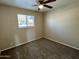 Bedroom with carpet flooring and large window at 3637 W Myrtle Ave, Phoenix, AZ 85051