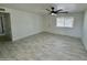 Spacious living area with tile floors and access to hallway at 3637 W Myrtle Ave, Phoenix, AZ 85051