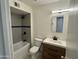 Updated bathroom with a soaking tub and modern vanity at 3637 W Myrtle Ave, Phoenix, AZ 85051