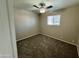 Bright bedroom with ceiling fan and carpeting at 3637 W Myrtle Ave, Phoenix, AZ 85051