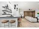 Modern basement bar with sleek cabinetry and comfortable seating at 6921 N Joshua Tree Ct, Paradise Valley, AZ 85253