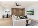 Finished basement with a sectional sofa, large TV, and a wet bar at 6921 N Joshua Tree Ct, Paradise Valley, AZ 85253