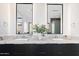 Elegant bathroom with dual vanities, marble countertops, and large mirrors at 6921 N Joshua Tree Ct, Paradise Valley, AZ 85253