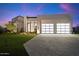 Modern house with two-car garage and landscaping at 6921 N Joshua Tree Ct, Paradise Valley, AZ 85253