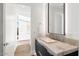 Modern bathroom with marble vanity and large mirror at 6921 N Joshua Tree Ct, Paradise Valley, AZ 85253