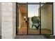 Bright entryway with glass doors and hardwood floors at 6921 N Joshua Tree Ct, Paradise Valley, AZ 85253
