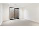 Bright bedroom with sliding door leading to backyard at 6921 N Joshua Tree Ct, Paradise Valley, AZ 85253