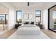 Bright bedroom with large windows, a plush bed, and a view of the backyard at 6921 N Joshua Tree Ct, Paradise Valley, AZ 85253