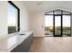 Modern indoor bar with white countertop and backyard view at 6921 N Joshua Tree Ct, Paradise Valley, AZ 85253