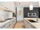 Modern kitchen with marble countertops and stainless steel appliances at 6921 N Joshua Tree Ct, Paradise Valley, AZ 85253