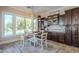 Kitchen nook with wooden table, chairs, and view of the pool at 3414 E Virgil Dr, Gilbert, AZ 85298