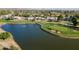Aerial view of community with lake and golf course at 8133 E Cortez Dr, Scottsdale, AZ 85260