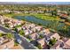 Aerial view of home community near lake and golf course at 8133 E Cortez Dr, Scottsdale, AZ 85260