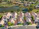 Aerial view of row of homes near a lake and golf course at 8133 E Cortez Dr, Scottsdale, AZ 85260