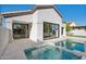 Modern pool and spa with glass doors leading to interior at 8133 E Cortez Dr, Scottsdale, AZ 85260