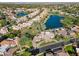 Aerial view showcasing a luxury home near a lake and golf course at 8133 E Cortez Dr, Scottsdale, AZ 85260