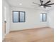 Bright bedroom with hardwood floors and ceiling fan at 8133 E Cortez Dr, Scottsdale, AZ 85260