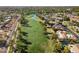 Aerial view of a luxury home community with golf course and lake at 8133 E Cortez Dr, Scottsdale, AZ 85260