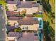 Aerial view of homes with tile roofs and pools in a community at 8133 E Cortez Dr, Scottsdale, AZ 85260