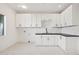 Bright laundry room with white cabinets and dark countertop at 8133 E Cortez Dr, Scottsdale, AZ 85260